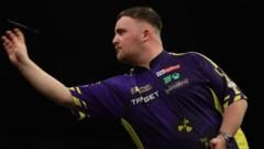 World Champion Luke Littler Dominates Ryan Searle to Secure Place in World Matchplay Last 16